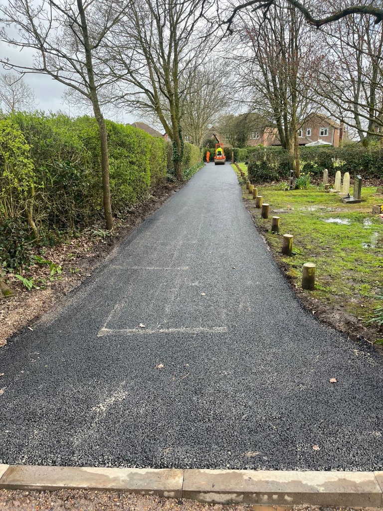 Completed cemetery footpath — asphalt wearing course and finishing operations