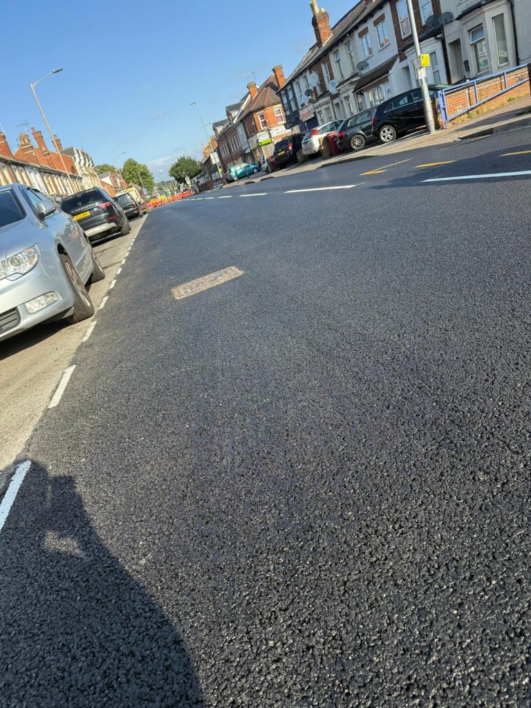 Residential terrace street — machine-laid asphalt with bay markings